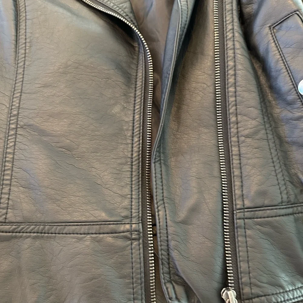 Edgy Moto jacket with studs, perfect layering over jeans or a skirt